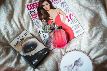 magazine and book on the bed